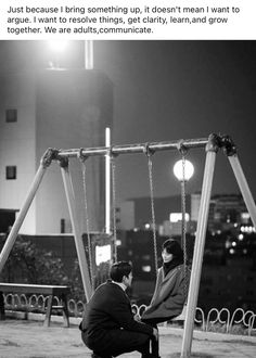 two people sitting on swings in front of a cityscape with the caption just because i bring something up, it doesn't