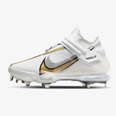 a white and gold football shoe on a white background