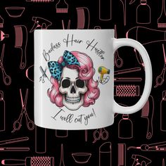 a white coffee mug with pink hair and skull on it, surrounded by various tools