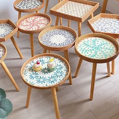 several small tables with different designs on them