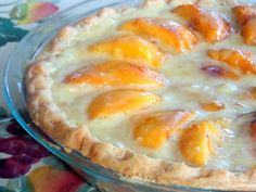 there is a pie with peaches on it