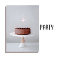 a birthday cake with a sparkler on top and the words party written across it