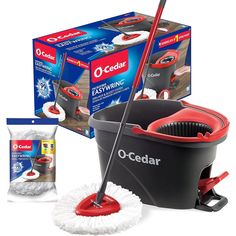 the o - cedar mop and bucket are set up with cleaning supplies in front of it