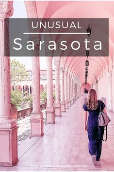 a woman walking down a long hallway with columns on both sides and the words unusual sarasota above it