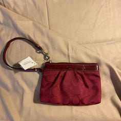 Nwt Coach Signature Patent Leather And Fabric Wristlet Color Is Crimson New With Tags And Coach Card Inside Standard Wristlet With Zipper Closure 1 Interior Pocket Retails $140 Evening Clutch Wristlet, Red Clutch Wristlet With Zipper Closure, Red Clutch Wristlet For Travel, Elegant Pouch Wristlet With Adjustable Strap, Elegant Wristlet With Adjustable Strap, Red Coach Wristlet For Everyday Use, Elegant Red Wristlet With Zipper Pouch, Coach Red Wristlet With Zipper Pouch, Coach Red Wristlet With Zipper Closure