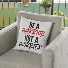 a pillow that says be a warrior not a wompier on it sitting in a chair