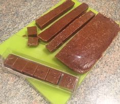 there are four pieces of chocolate on the cutting board