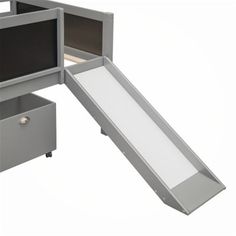 an office cubicle with a slide and drawers on the bottom floor, in front of a white background