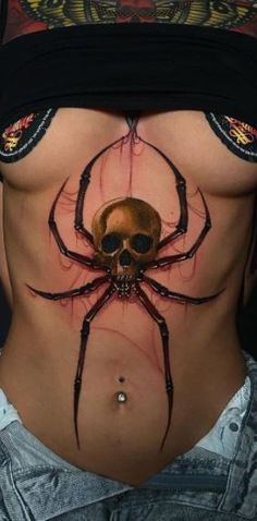 a woman with a spider tattoo on her stomach