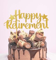 a cake with chocolate and marshmallows on top that says happy retirement in gold lettering