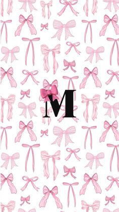 the letter m is surrounded by pink bows