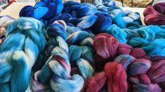 several skeins of dyed wool are on display