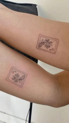 two people with tattoos on their legs, one has a stamp and the other has a flower