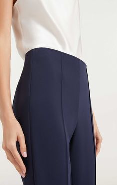 Flaunt a slim and stylish silhouette in the Brianne Pant, constructed in our Drapey Crepe fabric. Lightweight and versatile, this piece of workwear offers pintuck detail and side slits for an edgy twist. Details Hidden zipper on sideFabric: Drapey CrepeAnkle lengthSide slit detail High rise Content and Care 69% Triacetate 31% PolyesterDry Clean OnlyImported Measurements 31in/78.74cm, inseamMeasurements from size 4 Dyes from some clothing, such as those used on denim jeans, might migrate to lighter colors and skin especially under conditions of high humidity. This occurrence is irreversible and we do not assume responsibility for dye transfer. Crepe Fabric, Pin Tucks, Hidden Zipper, Denim Jeans, Work Wear, High Rise, Size 4, Dye, Twist