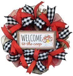 a welcome to the coop wreath with red and black bows