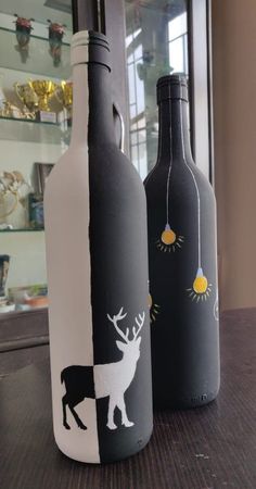 two wine bottles painted to look like animals