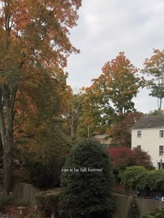 a white house surrounded by trees with fall foliage in the foreground and an inscription that reads can't be all forever