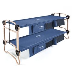 two blue folding beds with wheels on each one and the other side is shown in front of a white background