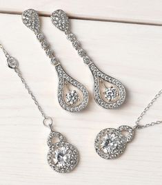 Bridal Accessories, Silver Jewelry, Teardrop Earrings, Jewelry Earrings, Dainty Earrings, Cubic Zirconia Earrings ► Spend $200 | Receive 10% OFF Your Order with Code: 10OFF200 ► Please note in your order when your wedding date is Classic linear 18K white gold earrings decorated in cubic zirconia pave crystals. Complete the look with a side-swept bun for an angelic yet sultry look. MATERIALS & MEASUREMENTS - 18K White Gold or Gold over Brass - Cubic Zirconia Pave Crystals - Hypoallergenic, le Elegant Jewelry Sets With Matching Dangle Earrings, Sterling Silver Jewelry Sets With Drop Earrings, Anniversary Jewelry Sets With Drop Earrings, Teardrop Jewelry Sets With Matching Earrings For Anniversary, Anniversary Teardrop Jewelry Set With Matching Earrings, Formal Drop Jewelry Sets With Matching Earrings, Cubic Zirconia Jewelry Sets With Dangle Earrings, Unique Wedding Earrings, Silver Bridal Earrings