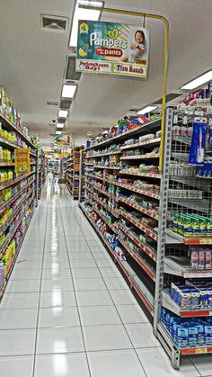 an aisle in a grocery store filled with lots of food