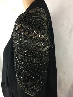 SACHIN & BABI ONE BEADED SEQUINS SHOULDER Shawl Collar SZ 4 BLACK BLAZER,CARDIGAN WOMEN’S JACKET.Beautiful elegant. Pre-Owned in very Good Used Condition Gently Worn. (No Rips,stains, holes, or excessive signs of wear.)Some unnoticeable beads row missing closer to the bottom still functional beautiful beaded work of art. (Please see the last photos for details, check measurements and don’t hesitate to ask questions before purchasing an item.) Approximately Flat Measurements not stretched: • Shou Black Embellished Long Sleeve Blazer, Embellished Black Blazer For Fall, Black Embellished Evening Outerwear, Black Embellished Fall Blazer, Black Embellished Evening Blazer, Long Sleeve Embellished Outerwear For Party, Beaded Long Sleeve Evening Outerwear, Glamorous Beaded Outerwear For Evenings, Glamorous Beaded Evening Outerwear