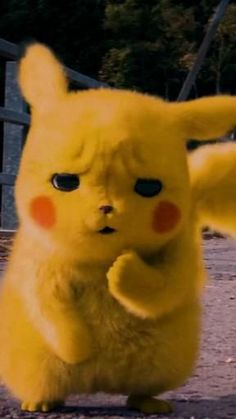 a yellow pikachu standing on its hind legs