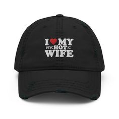 "I Love My Hot Wife Distressed Dad Hat | Funny Hat For Husband | Anniversary Gift | Wedding Gift | Gift for Him  Matching T-Shirt: https://printworkshopcompany.etsy.com/listing/1661274104/i-love-my-wife-shirt-gift-for-husband Matching Sweatshirt: https://printworkshopcompany.etsy.com/listing/1661287474/i-love-my-wife-sweatshirt-gift-for ** VIP Email List Be sure to join our VIP Email list for new product releases, special promotions, and giveaways! https://email.everbee.io/subscribe?shopName=PrintWorkshopCompany ** HOW TO ORDER 1. Check our photos for color options.  2. Select color from the drop-down menu.  3. Click \"ADD TO CART\" to add the hat to your cart. 4. Click \"PROCEED TO CHECKOUT\" to purchase your hat. ** SIZE One size fit all with adjustable strap. ** DETAILS: - 100% pre-shru The Man Who Mistook His Wife For A Hat, I Heart My Wife, Husband And Wife Hats, Husband Wife Hoodies, For Husband, I Love When My Wife Shirt, Wife Sweatshirt, Husband Anniversary Gift, Husband Anniversary