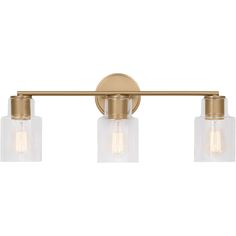 three light bathroom fixture with clear glass shades and gold metal finish, on an off white background