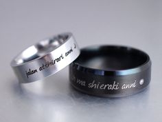 two wedding rings with names engraved on them