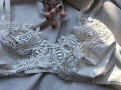 Dainty, lightweight, elastic satin bra from the 1970's-80's with a luxurious thick satiny shiney lace and butterflies Xs-s Eur 70-75B UK 32-34B Excellent condition Faded label inside White Feminine Bra With Lace Closure, Feminine White Bra With Lace Closure, Lace Bodice Bra For Weddings, Cream Lace Bra With Lace Trim, Summer Lace Bra In Cream Color, Cream Lace Bra For Summer, Summer Wedding Bra With Built-in Support, Wedding Underwire Bra With Lace Closure, Wedding Bra With Lace Closure And Underwire