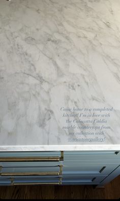 a white marble counter top with writing on it