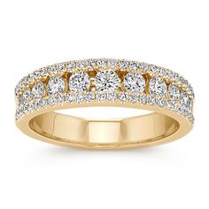 Classic brilliance at its best; this ravishing wedding band features diamonds of varying sizes as the center isle and is outlined by additional diamonds. This band showcases 63 round diamonds  at approximately .75 carat total weight  that have each been hand-matched for sparkle and crafted in quality 14 karat yellow gold. She is sure to dazzle every day with this breathtaking channel-set band. Beautiful Wedding Bands, Wedding Expenses, Classic Wedding Band, Bold Rings, Wedding Bar, Fine Jewelry Collection, Classic Wedding, Anniversary Bands, Diamond Band