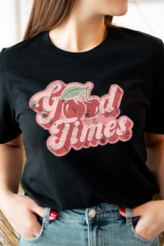 The "Retro Good Times Cherry Fruit" graphic T-shirts encapsulate a nostalgic vibe with their vibrant design showcasing cherries, symbolizing joy and sweetness reminiscent of a bygone era. These T-shirts not only offer a stylish throwback to retro aesthetics but also provide wearers with a fashionable and comfortable piece for casual occasions. With their lively graphics and retro charm, these shirts become a fun and expressive way to celebrate the good times in a timeless and playful fashion.Mad Fruit Graphic, Playful Fashion, Mood Lifters, Cherry Fruit, Look Short, Bygone Era, Cherry Print, Vibrant Design, Feminine Look