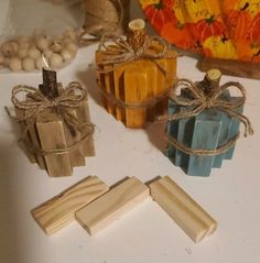 soaps and wooden blocks on a table with pumpkins in the backround