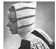 a woman wearing a crocheted hat and scarf in black and white, with her eyes closed