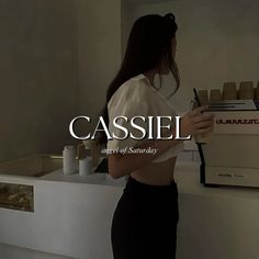 a woman standing in front of a coffee machine