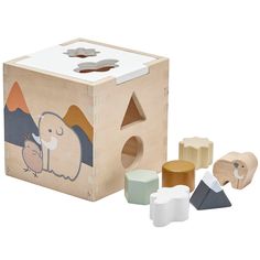 a wooden block with various shapes and sizes on it, including an elephant shaped building