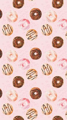 a pink background with donuts and sprinkles