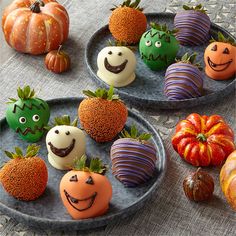 there are many halloween treats on the plates