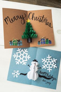 two christmas cards with paper snowmen on them and a tree made out of origami