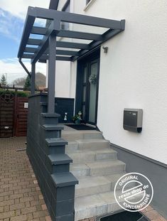 an outdoor stair case with steps leading up to the front door