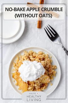 a white plate topped with an apple crumble and whipped cream on top of it