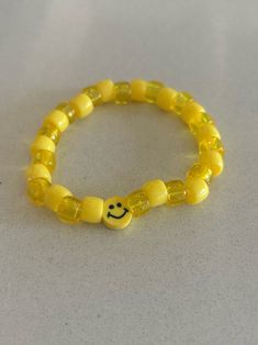 yellow smiley face beaded bracelet Trendy Yellow Jewelry With Letter Beads, Yellow Beaded Bracelets With Round Beads For Everyday, Handmade Trendy Yellow Bracelets, Trendy Handmade Yellow Bracelets, Casual Yellow Bracelets With Letter Beads, Smiley Face Beaded Bracelets As Gift, Smiley Face Round Beads Friendship Jewelry, Yellow Letter Beads Friendship Bracelets, Cute Yellow Jewelry With Letter Beads