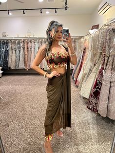 This chocolate brown outfit comes with an embroidered top and pants. The pre-draped saree completes the look effortlessly DELIVERY TIMEPlease allow 6-8 weeks for your outfit to arrive. FABRIC DETAILSPower Net, Silk Professional cleaning only. Festive Fitted Brown Lehenga, Fitted Brown Lehenga For Festive Occasions, Fitted Brown Sets For Festivals, Fitted Brown Sets For Diwali, Brown Saree Set For Diwali, Festive Brown Party Sets, Bollywood Style Designer Brown Set, Brown Pre-draped Saree For Festive Occasions, Fitted Brown Saree Set