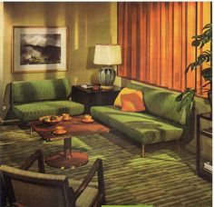 a living room filled with green couches and chairs