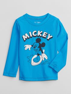 a blue shirt with mickey mouse on it