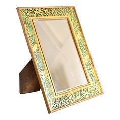 A rare and outstanding antique Arts & Crafts period Pine Needle framed mirror  By Tiffany Studios (signed en verso)  New York, USA, Early 20th Century  Gilt bronze in iconic pine needle pattern, with beautiful green slag glass.  Measures: 7"W x 5"D x 9"H. Mirror opening is 4.25"W x 6.38"H  Good original vintage condition, with beautiful patina from age.  Pairs nicely with Art Deco, Arts & Crafts, or Art Nouveau decor. Framed Vanity Mirror, Tiffany Studios, Art Nouveau Decor, Framed Mirror, Pine Needles, Glass Frames, Mirror Frames, Antique Art, Early 20th Century