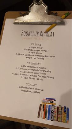 a sign that is on top of a clipboard with a bookclub in it