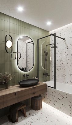 a bathroom with a sink, mirror and bathtub next to a bench in front of a tiled wall