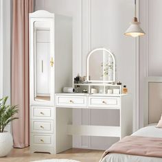 a bedroom with white furniture and pink curtains on the windowsill, along with a large mirror